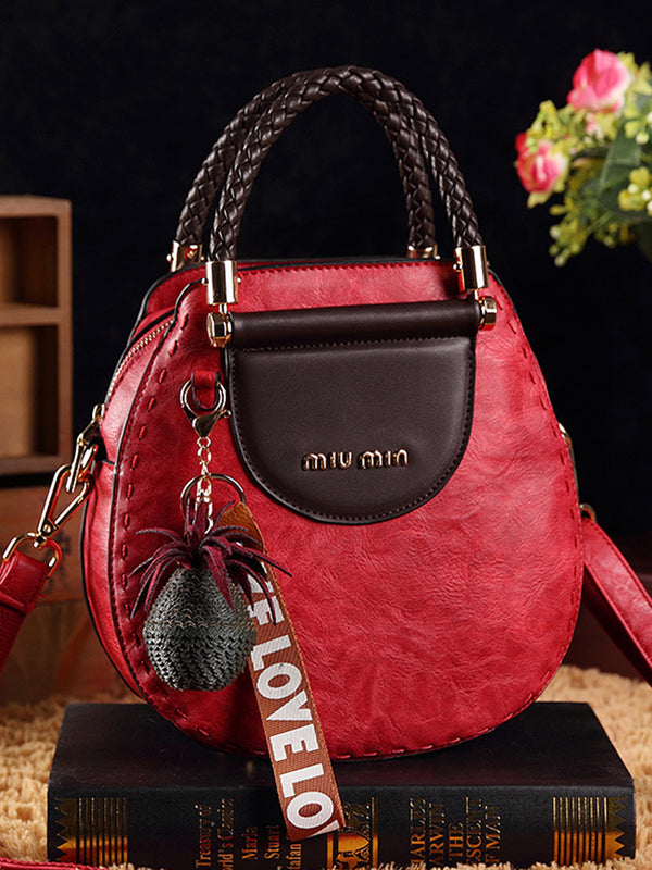 Kerek formájú vintage bőrtáskák, bojtokkal. Válltáska