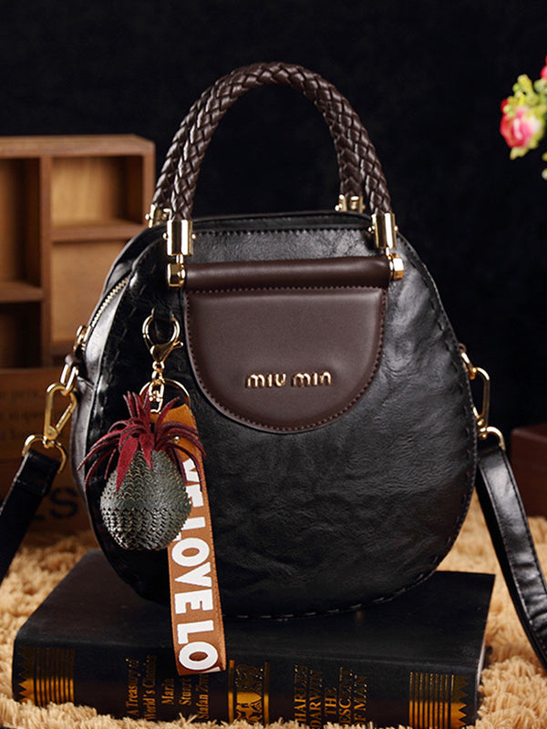 Kerek formájú vintage bőrtáskák, bojtokkal. Válltáska