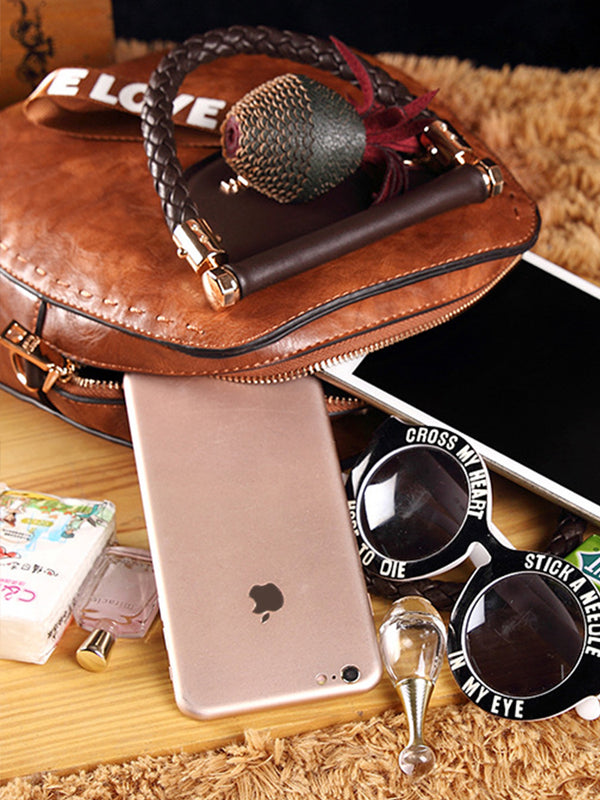 Kerek formájú vintage bőrtáskák, bojtokkal. Válltáska