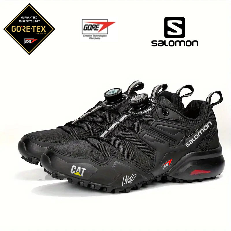 Vízálló GTX túracipő CAT és Salomon márkától, kényelmes és kopásálló (limitált kiadás F1-es pilóta aláírásával)